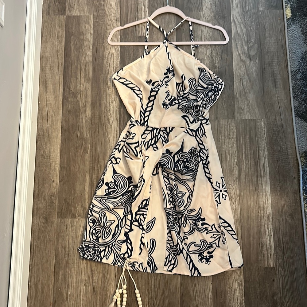 Brand new apricot colored dress with blue design